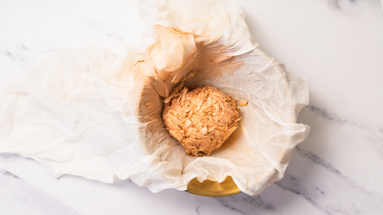 Grated potatoes in cheesecloth.