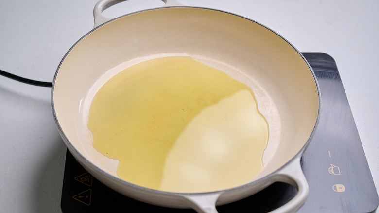 heating oil in a large pot