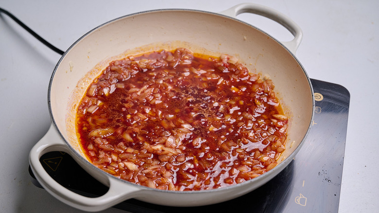 deglazing tomato paste with red wine