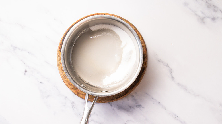 Sugar and water in saucepan