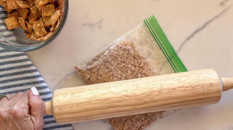 hands rolling cereal to crush