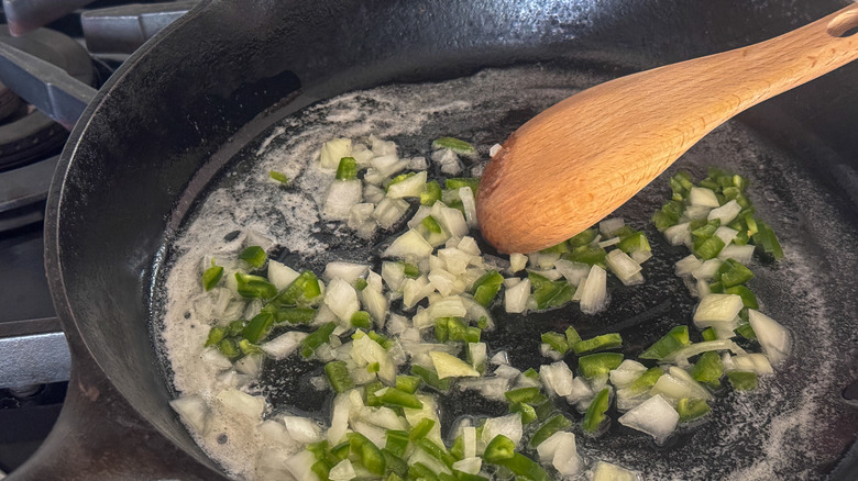 stirring the onion and jalapeño