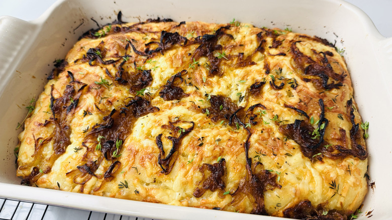 Caramelized onion focaccia with thyme in baking dish