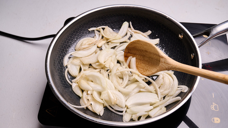 cooking onions in a skillet