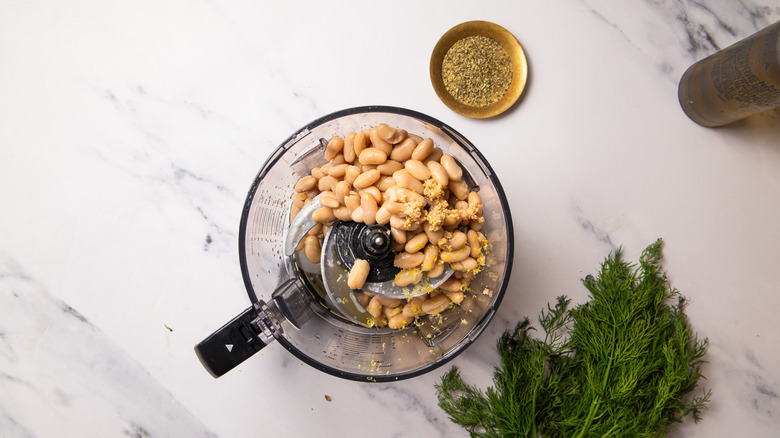 White beans and seasonings in blender