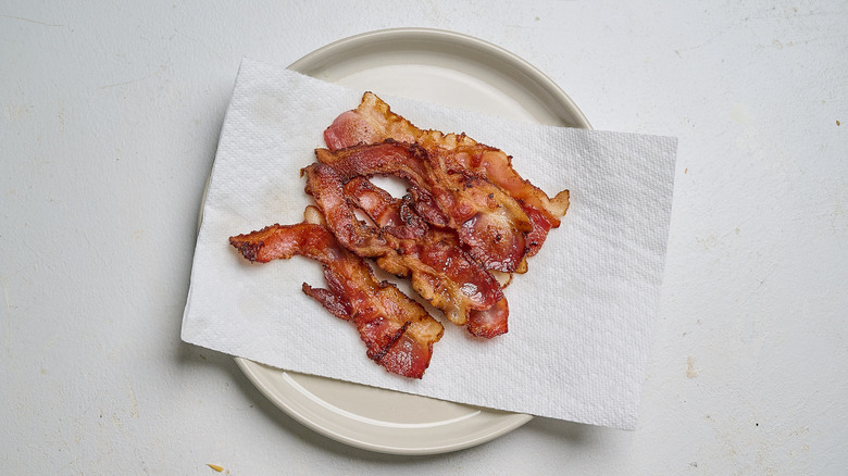 cooked bacon on paper towel lined plate